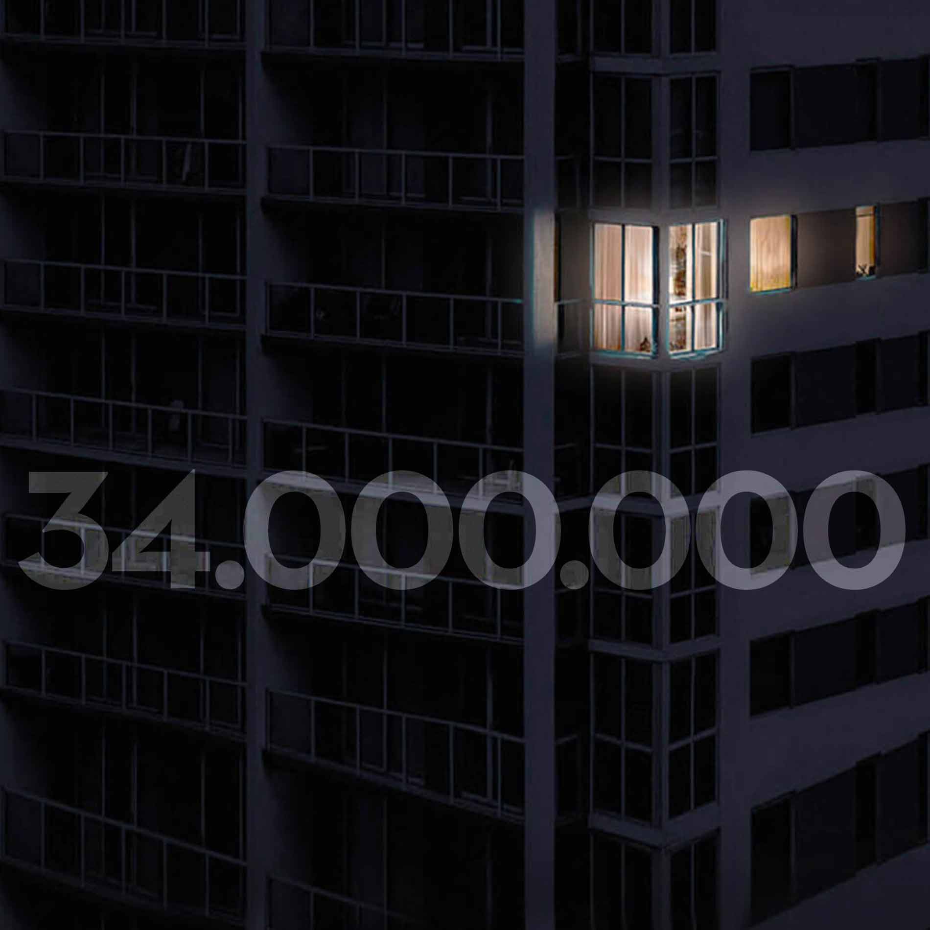 Wolkenkrabber 's nachts met een verlicht appartement | mey® 