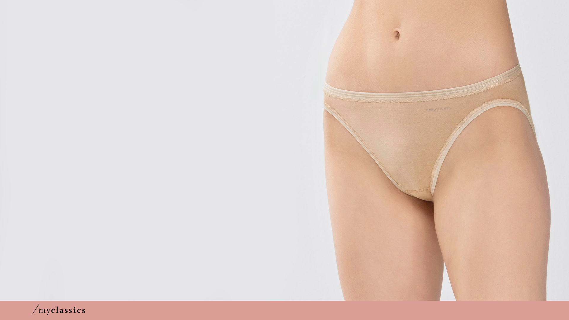 Woman wears mini briefs in the colour Pearl from the mey Lights basics series from mey | mey®