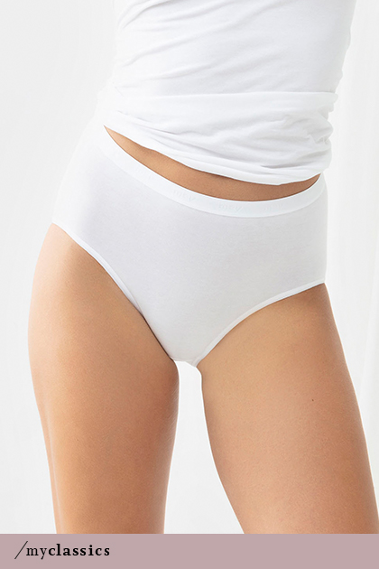 Woman wears white high-cut seamless briefs made of Peruvian Pima cotton from the Best Of series | mey®