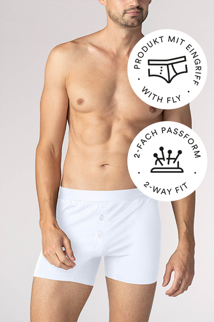 Business Class series, white trunk shorts on the model | mey® , icon for fly: Briefs with outlined fly, icon for two-way fit: pin cushion with four pins | mey® 